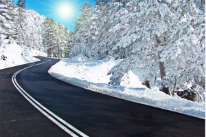 Road through snow covered mountain