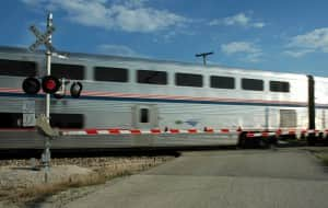 Train going through railroad crossing